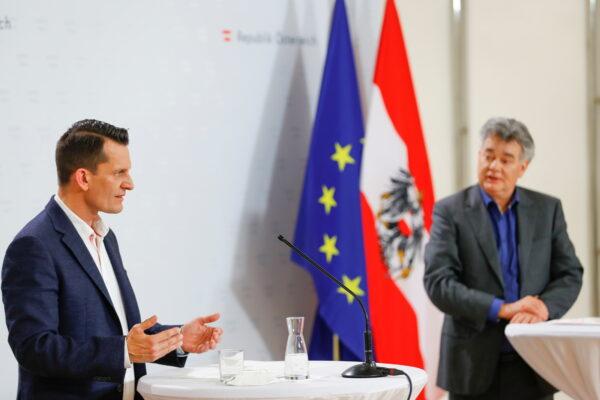 Austrian Vice Chancellor Werner Kogler and designated Health Minister Wolfgang Mueckstein attend a news conference in Vienna, Austria, on April 13, 2021. (Leonhard Foeger/Reuters)