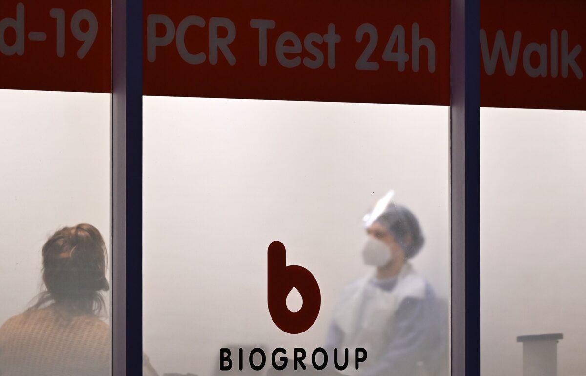 A logo is pictured on a window at Biogroup Laboratory's lab, where they are conducting rapid PCR tests, testing for the CCP virus, in west London on Jan. 21, 2021. (Justin Tallis/AFP via Getty Images)