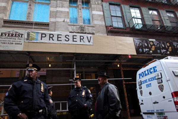 Police stand at the scene where Mark Madoff, son of Bernard Madoff, was found dead in New York City, on Dec. 11, 2010. (Yana Paskova/Getty Images)
