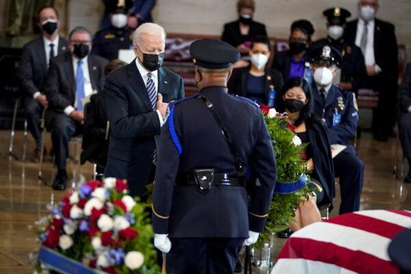 President Joe Biden pays his respects at the casket of the late U.S. Capitol Police officer William Evans during a memorial service as Evans lies in honor in the Rotunda at the U.S. Capitol in Washington, on April 13, 2021. (Drew Angerer/Pool via Reuters)