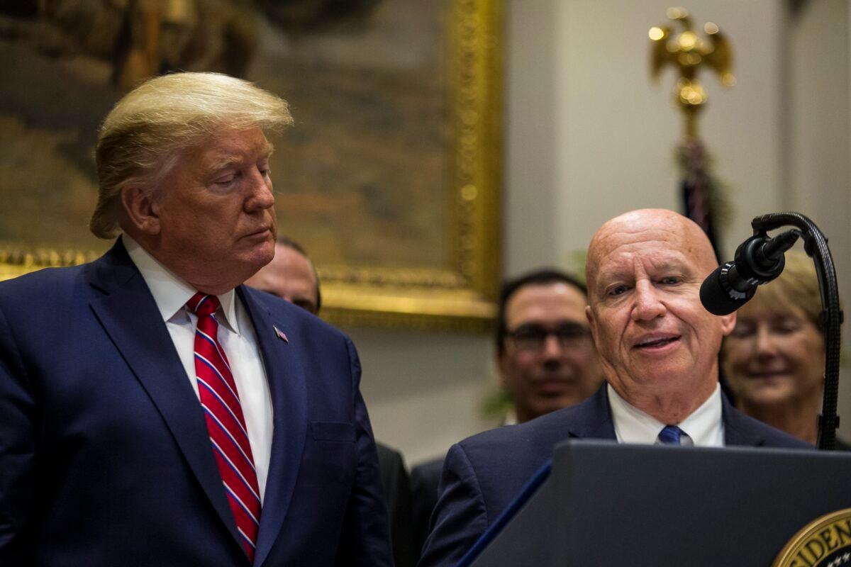 Then-President Donald Trump, left, listens as Rep. Kevin Brady (R-Texas) speaks, at the White House in Washington on Nov. 15, 2019. (Zach Gibson/Getty Images)
