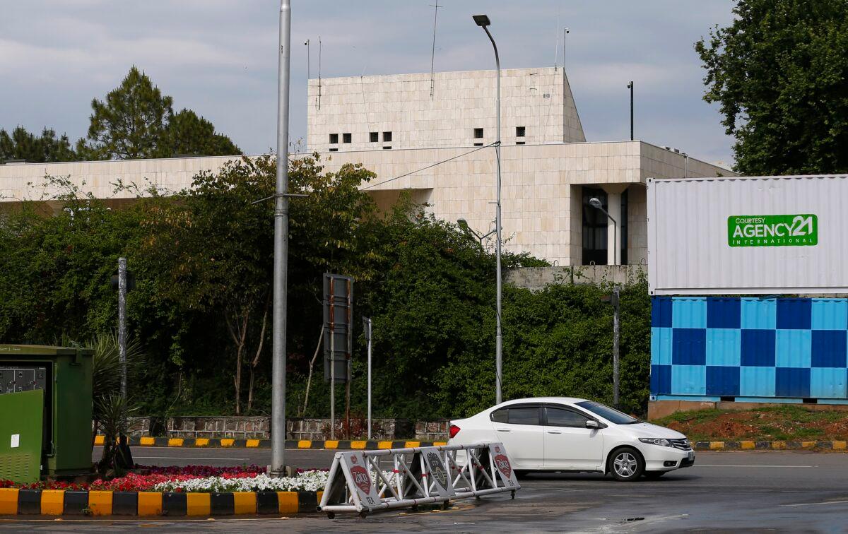 A car drives past the French Embassy, in Islamabad, Pakistan, on April 15, 2021. (Anjum Naveed/AP Photo)