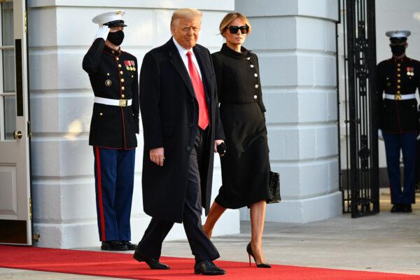 President Donald Trump and First Lady Melania make their way to board Marine One before departing from the South Lawn of the White House in Washington, D.C., on Jan. 20, 2021. (Mandel Ngan/AFP via Getty Images)
