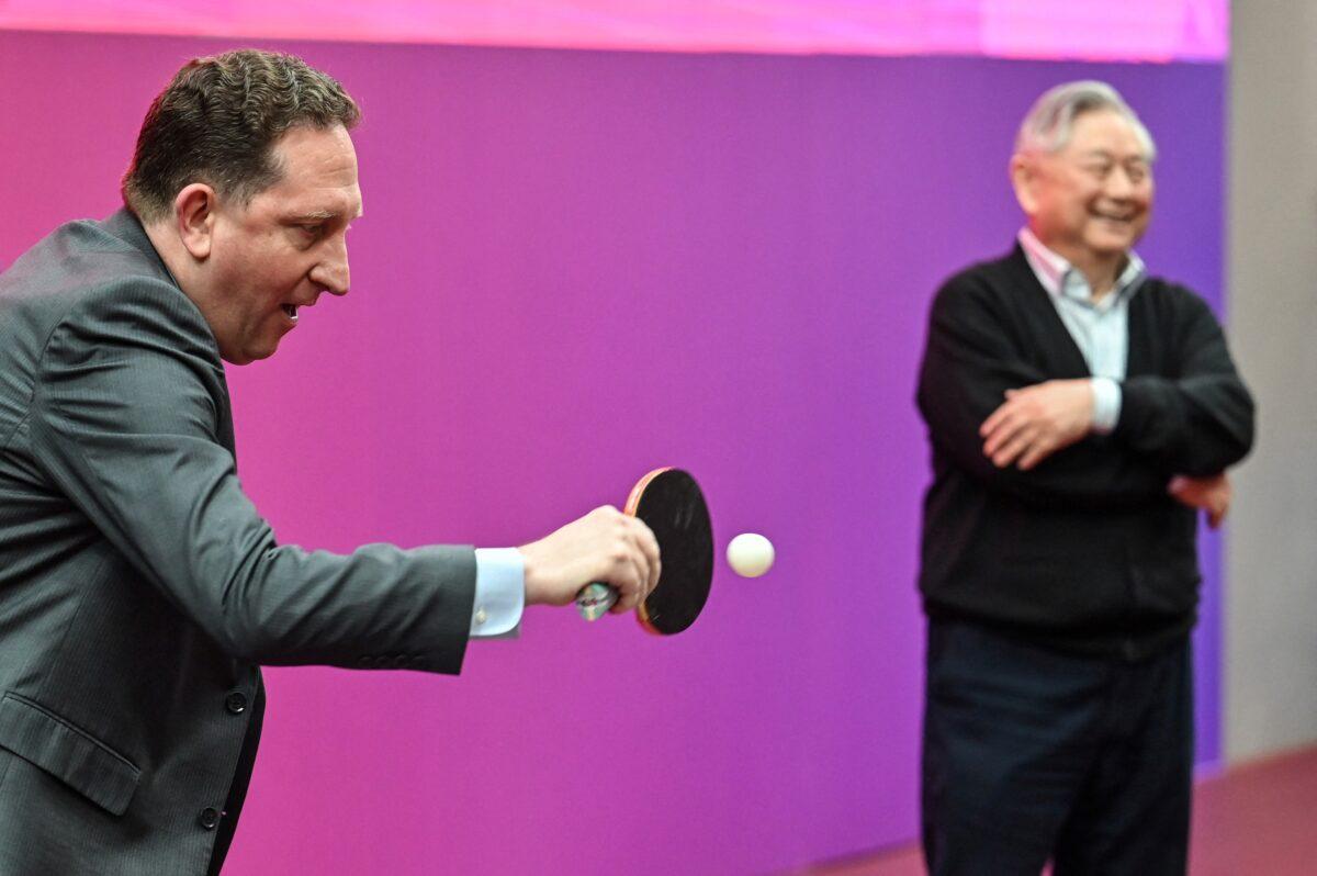  U.S. Consul General in Shanghai James Heller plays table tennis during a ceremony to mark the 50th anniversary of "ping-pong diplomacy," at the International Table Tennis Federation museum in Shanghai on April 10, 2021. (Hector Retamal/AFP via Getty Images)