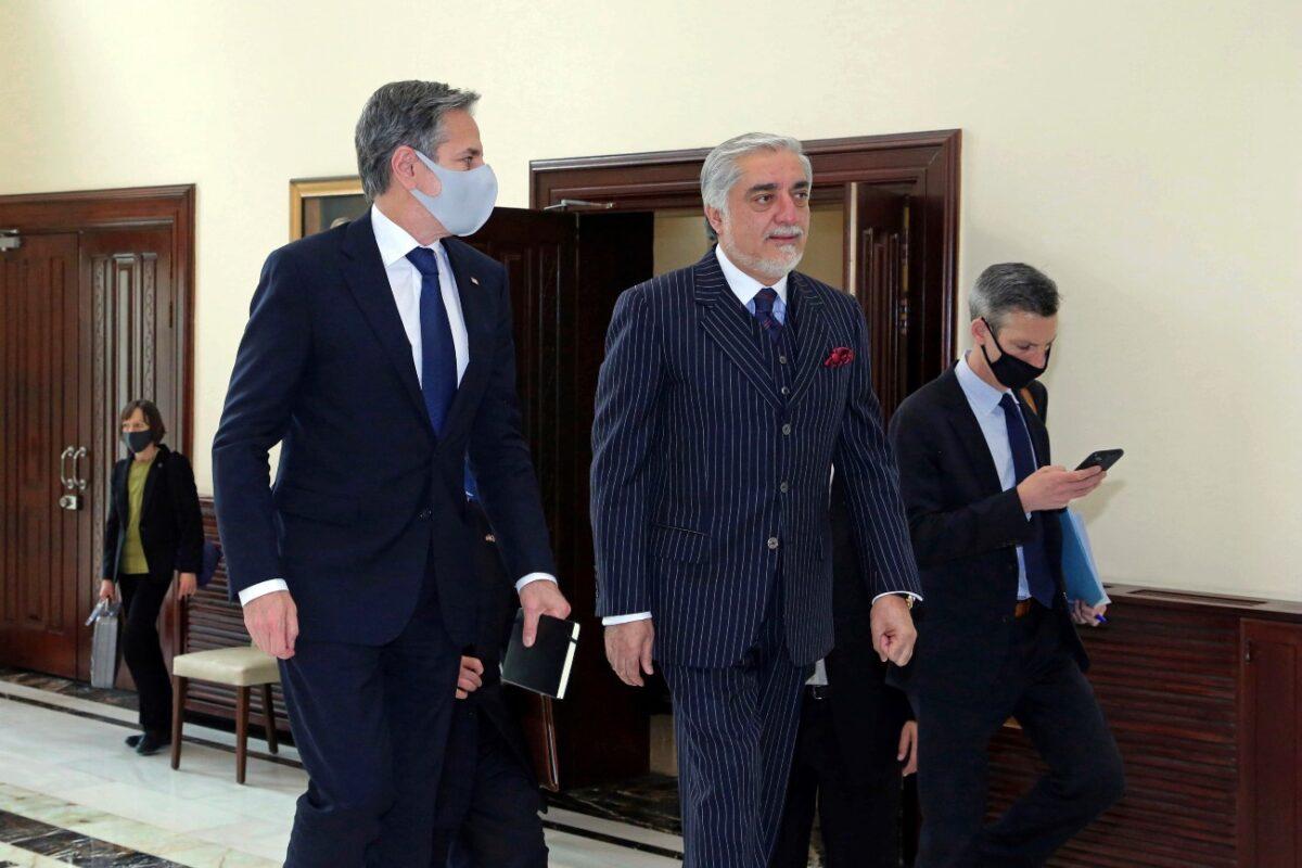 Abdullah Abdullah, Chairman of the High Council for National Reconciliation (C) walks with U.S. Secretary of State Antony Blinken, at the Sapidar Palace in Kabul, Afghanistan, on April 15, 2021. (Sapidar Palace via AP)