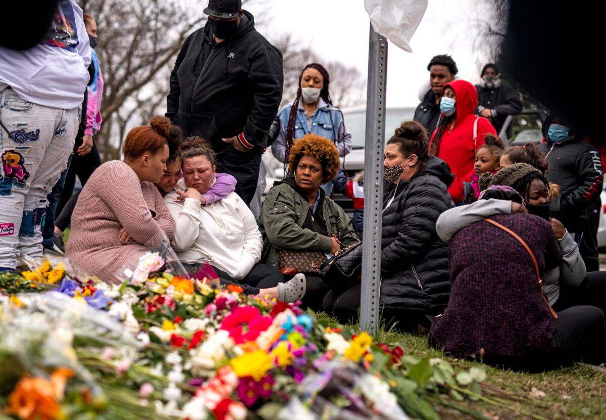 Members of Daunte Wright's family visit a memorial site near the place he was killed, n Brooklyn Center, Minn., on April 14, 2021. (Stephen Maturen/Getty Images)