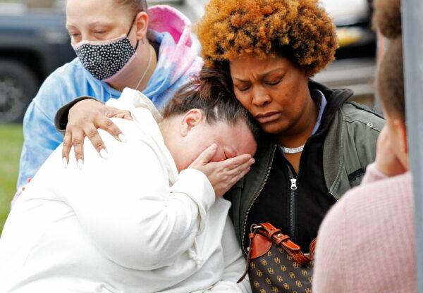 Daunte Wright's mother, left, and other family members mourn for Wright at a vigil near where he was fatally shot by a police officer days before, in Brooklyn Center, Minn., on April 14, 2021. (Nick Pfosi/Reuters)