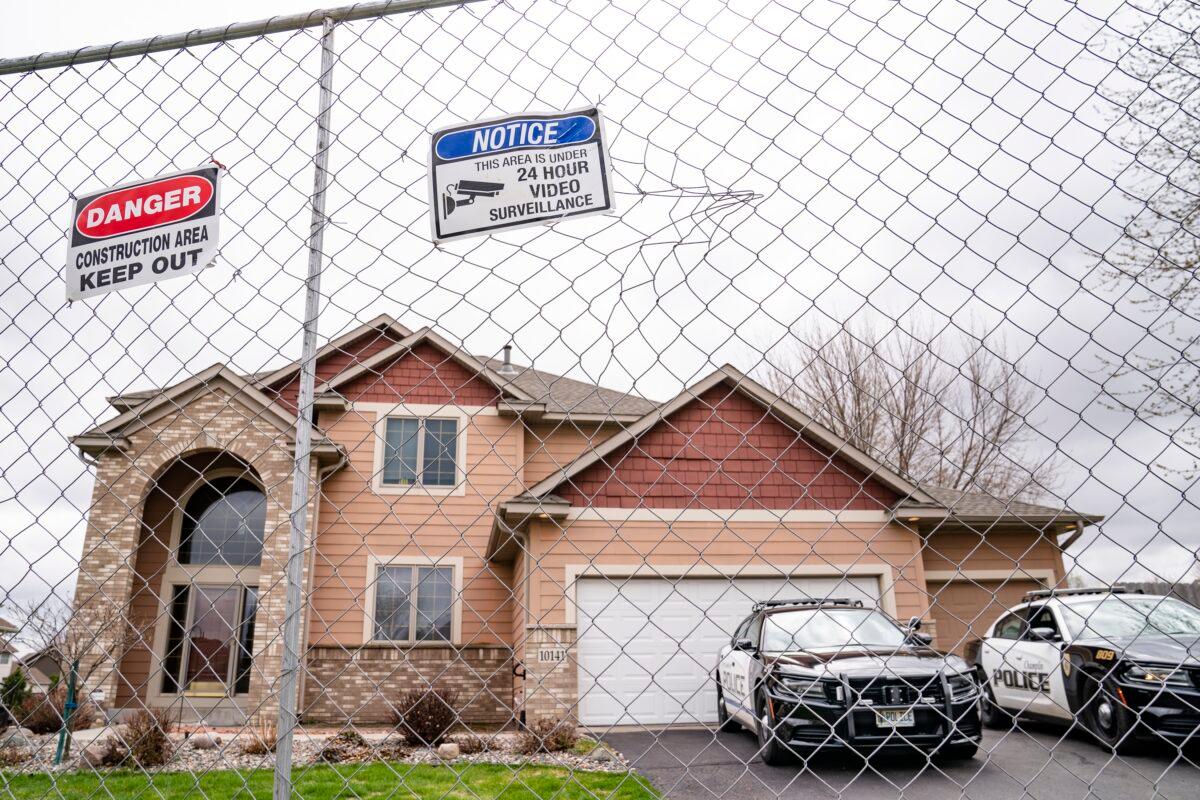 Fencing and concrete barriers surround the home of former Brooklyn Center police officer Kim Potter as local police guard her residence, in Champlin, Minn., on April 14, 2021. (John Minchillo/AP Photo)