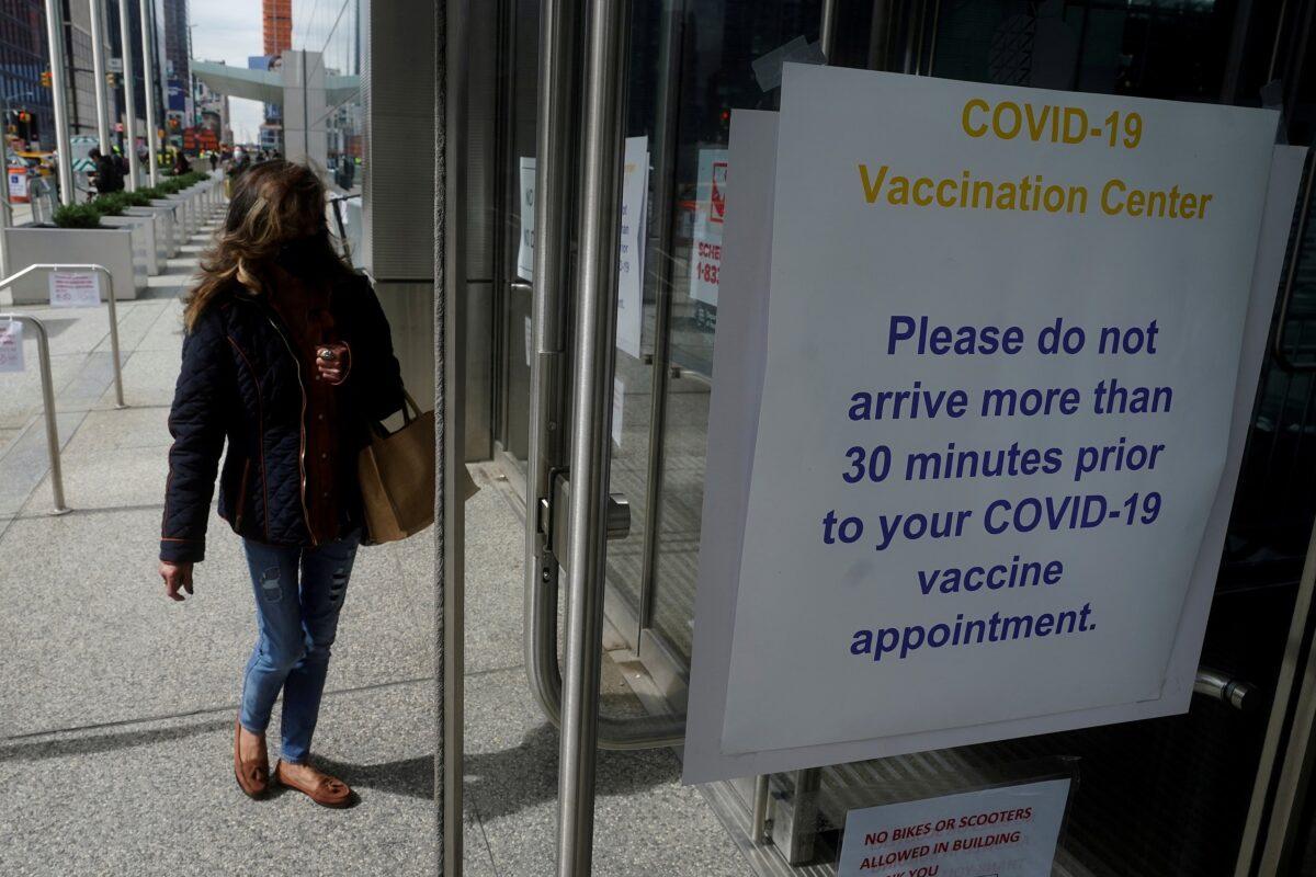 People arrive at the Javits Center mass vaccination location in the Manhattan borough of New York City on April 13, 2021. (Carlo Allegri/Reuters)