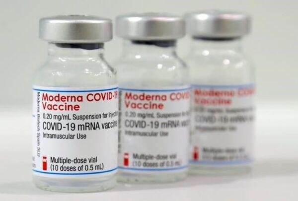 Three vials of the Moderna COVID-19 vaccine are pictured in a new coronavirus, COVID-19, vaccination center at the Velodrome-Stadium in Berlin, Germany, on Feb. 17, 2021. (The Canadian Press/AP/Michael Sohn, pool)