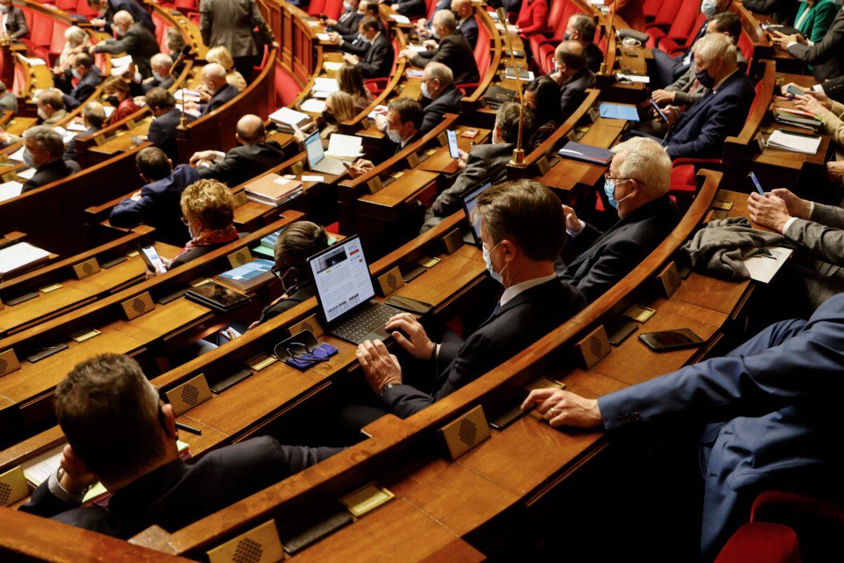 Members of Parliament attend a session of questions to the Government at the French National Assembly in Paris, on Feb. 9, 2021. (Ludovic Marin/AFP via Getty Images)