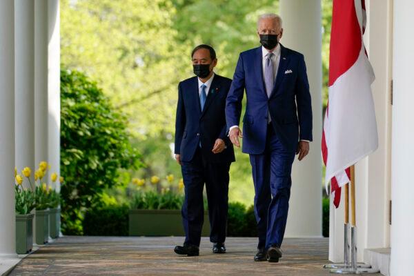 President Joe Biden and Japanese Prime Minister Yoshihide Suga walk from the Oval Office to a news conference in the Rose Garden of the White House in Washington, on April 16, 2021. (Andrew Harnik/AP Photo)