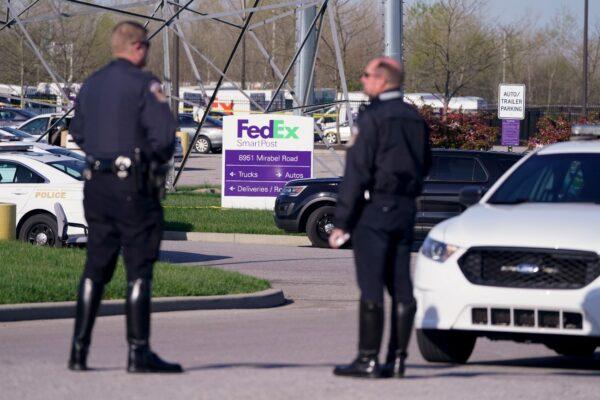 Police stand near the scene where multiple people were shot at the FedEx Ground facility in Indianapolis, early Friday morning, on April 16, 2021. (Michael Conroy/AP Photo)
