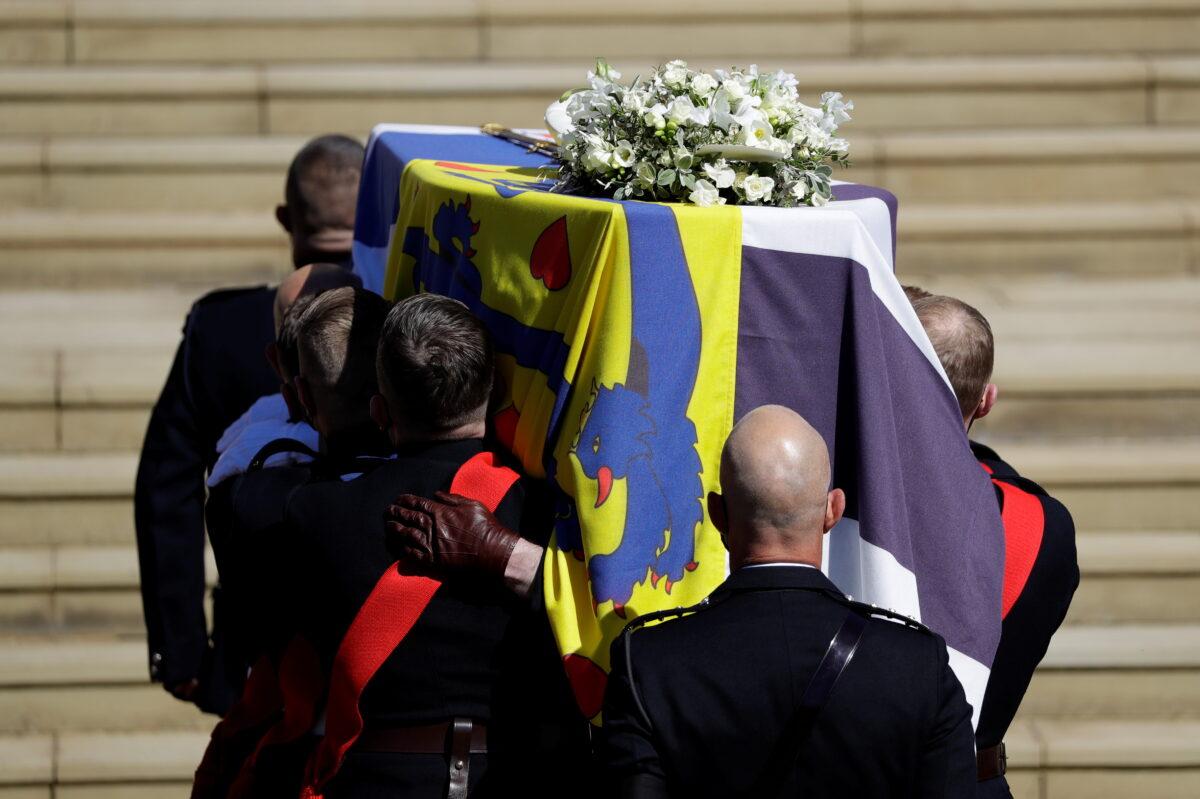 The coffin of Britain's Prince Philip, husband of Queen Elizabeth, who died at the age of 99, is taken into St. George's Chapel for a funeral service, in Windsor, Britain, on April 17, 2021. (Kirsty Wigglesworth/Pool via Reuters)