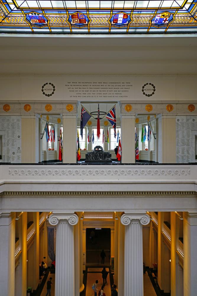 Neoclassical architecture and native art can be seen throughout the Auckland War Memorial Museum. In the center, a frieze decorated with repeating Koru, an unfurling silver fern frond, can be seen. The silver fern is a New Zealand native and a motif that is traditionally used in Maori art to represent peace, growth, and strength. (EQRoy/Shutterstock)