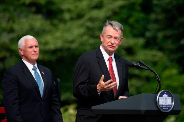 Then-Vice President Mike Pence (L) listens as Idaho Gov. Brad Little speaks at the White House in Washington, on July 16, 2020. (Jim Watson/AFP/Getty Images)