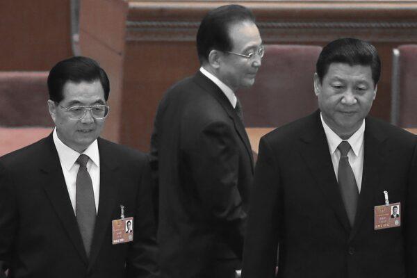 Former Chinese premier Wen Jiabao (C) walks past former Chinese leader Hu Jintao (L) and the current leader Xi Jinping (R) at the closing session of the rubber-stamp legislature’s congress in Beijing, China on March 17, 2013. (Feng Li/Getty Images)