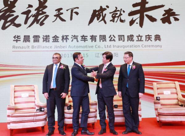 Renault-Nissan Chairman and CEO Carlos Ghosn (2nd L) and Brilliance Auto Chairman Qi Yumin (2nd R) greet each other during a press conference after the signing ceremony of a joint venture between Renault and Brilliance in Shenyang in China's northeastern Liaoning Province on Dec. 15, 2017. (STR/AFP via Getty Images)