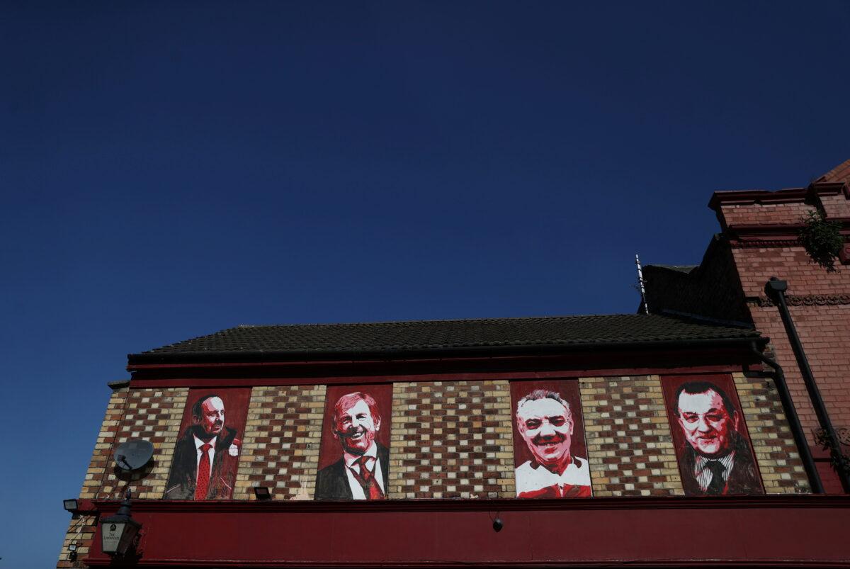 Images of Rafael Benitez, Kenny Dalglish, Joe Fagan, and Bob Paisley are seen outside Anfield as twelve of Europe's top football clubs launch a breakaway Super League, Liverpool, Britain, on April 19, 2021. (Carl Recine/Reuters)