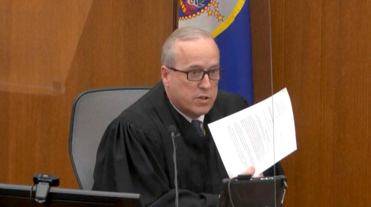 Hennepin County Judge Peter Cahill reads instructions to the jury before closing arguments at the Hennepin County Courthouse, Minn., on April 19, 2021. (Court TV via AP/Pool)