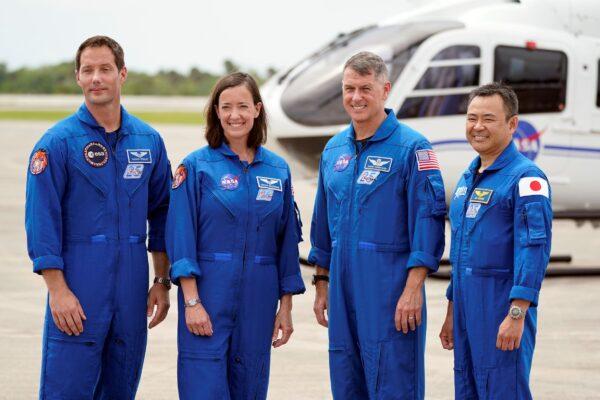 SpaceX Crew 2 members, from left, European Space Agency astronaut Thomas Pesquet, NASA astronauts Megan McArthur and Shane Kimbrough and Japan Aerospace Exploration Agency astronaut Akihiko Hoshide gather at the Kennedy Space Center in Cape Canaveral, Fla., on April 16, 2021. (John Raoux/AP Photo)