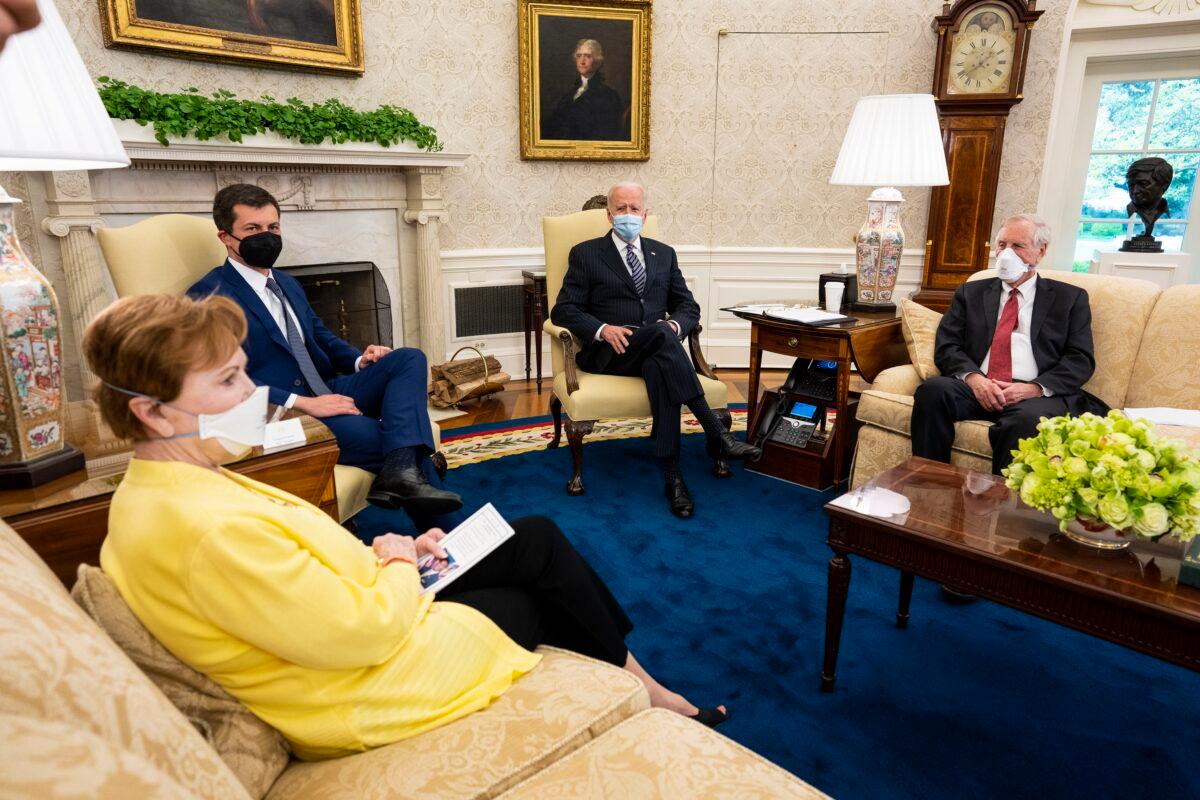 President Joe Biden (C) and Transportation Secretary Pete Buttigieg (C, L) meet with a bipartisan group of members of Congress, including Rep. Kay Granger (R-Texas) and Sen. Angus King (I-Maine) in Washington on April 19, 2021. (Doug Mills/Pool/Getty Images)