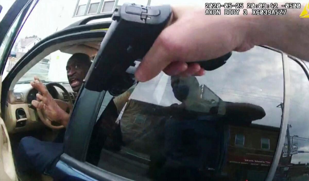 In this image from police body camera video George Floyd responds to police after they approached his car outside Cup Foods in Minneapolis, Minn., on May 25, 2020, as shown in the trial of former Minneapolis police Officer Derek Chauvin at the Hennepin County Courthouse in Minneapolis, Minn., on April 19, 2021. (Court TV via AP/Pool)