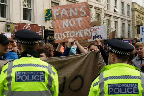 Chelsea fans protest outside Stamford Bridge stadium in London, against Chelsea's decision to be included amongst the clubs attempting to form a new European Super League, on April 20, 2021. (Matt Dunham/AP Photo)