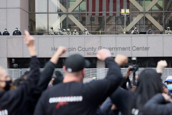 People react outside the Hennepin County Government Center after the verdict was read in the Derek Chauvin trial in Minneapolis, Minnesota, on April 20, 2021. (Scott Olson/Getty Images)