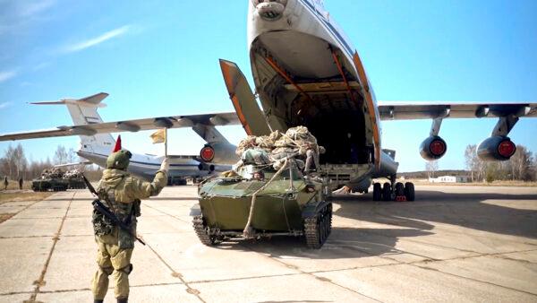 A Russian military vehicle is loaded into a plane for airborne drills during maneuvers in Crimea on April 22, 2021. (Russian Defense Ministry Press Service via AP)