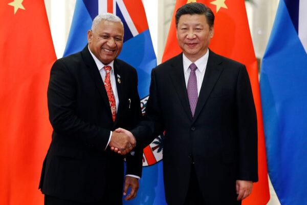 BEIJING, CHINA - MAY 16: Fiji's Prime Minister Josaia Voreqe Bainimarama shakes hands with Chinese President Xi Jinping as they meet at the Great Hall of the People on May 16, 2017, in Beijing, China. (Photo by Damir Sagolj-Pool/Getty Images)