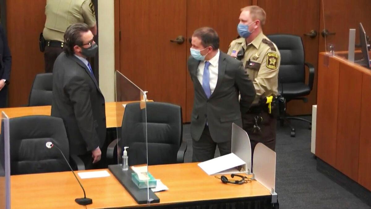 Former Minneapolis Police Officer Derek Chauvin (C) is taken into custody as his attorney, Eric Nelson (L), looks on after the verdicts were read at Chauvin's trial for the 2020 death of George Floyd at the Hennepin County Courthouse in Minneapolis, on April 20, 2021. (Court TV via AP)