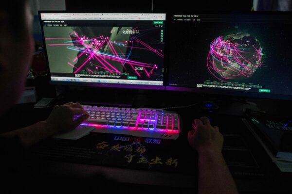  A hacker uses his computer in Dongguan, China's southern Guangdong province on Aug. 4, 2020. (Nicolas Asfouri/AFP via Getty Images)