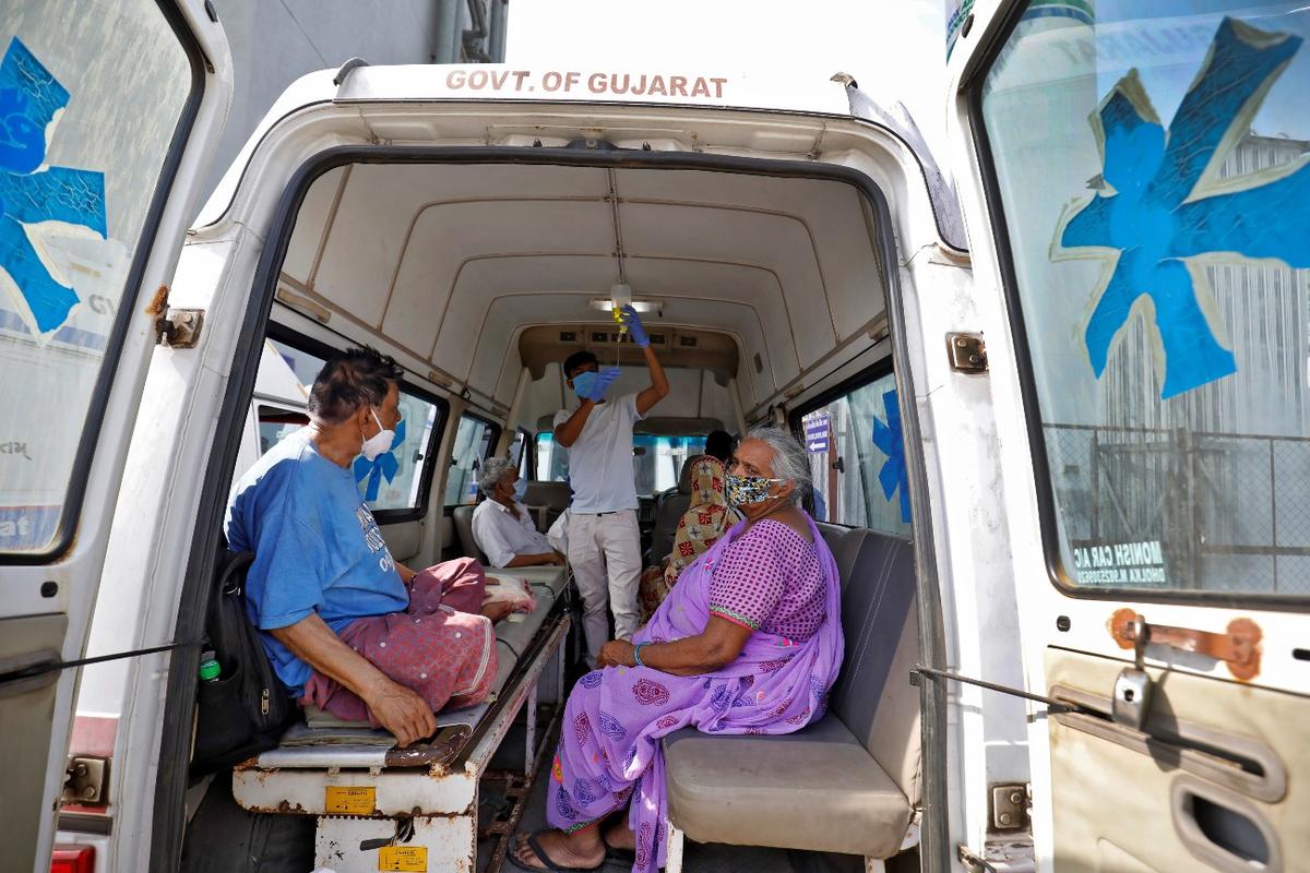 Patients are seen inside an ambulance while waiting to enter a COVID-19 hospital for treatment, amid the spread of COVID-19 in Ahmedabad, India, on April 22, 2021. (Amit Dave/Reuters)