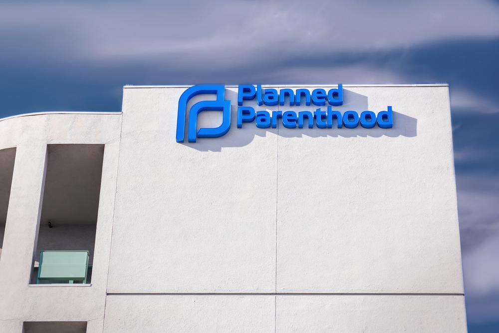 Planned Parenthood clinic exterior and logo. (Illustration - Ken Wolter/Shutterstock)