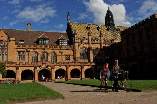 Students walk through The Quadrangle at the University of Sydney in Sydney, Australia, on May 8, 2013, (AAP Image/Paul Miller)
