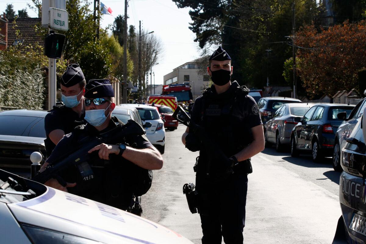 Police officer blocks the access next to the Police station in Rambouillet, south west of Paris, on April 23, 2021. (Michel Euler/AP Photo)