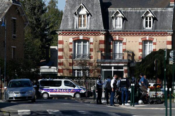 Police officers gather outside the Police station in Rambouillet, south west of Paris, after a 49-year-old female officer was stabbed to death inside the station by an Islamic extremist, who was shot and killed by police at the scene, France, on April 23, 2021. (Michel Euler/AP Photo)