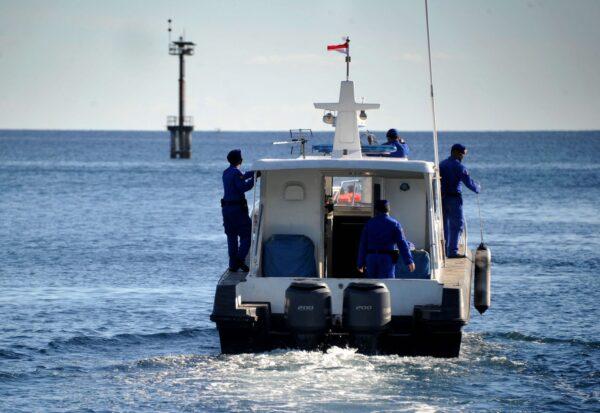 Indonesian marine police prepare to take part in the search operation for an Indonesian Navy submarine that went missing during military exercises off the coast of Bali, at Celukan Bawang port in Buleleng province on April 22, 2021. (Sonny Tumbelaka/AFP via Getty Images)