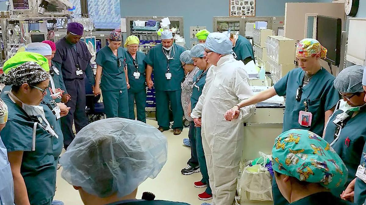 Doctors and nurses of Driscoll Children's Hospital praying before the surgery. (Courtesy of <a href="https://www.driscollchildrens.org/">Driscoll Children’s Hospital</a>)