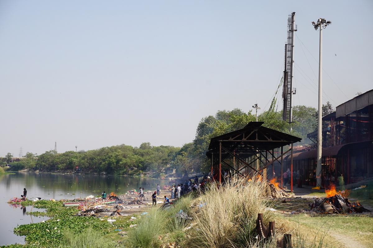 A path to the Nigam Bodh Ghat from the riverside in Delhi led to many pyres burning on the bank of the river Yamuna on April 24, 2021. Photography was prohibited inside. (Venus Upadhayaya/Epoch Times)