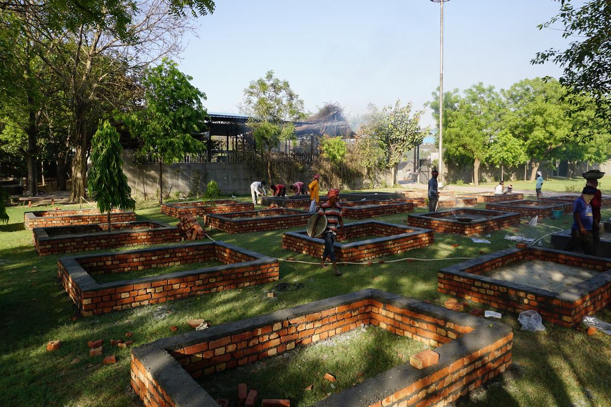 Construction of new pyre platforms happening at Sarai Kale Khan cremation ground on April 24, 2021. (Venus Upadhayaya/The Epoch Times)