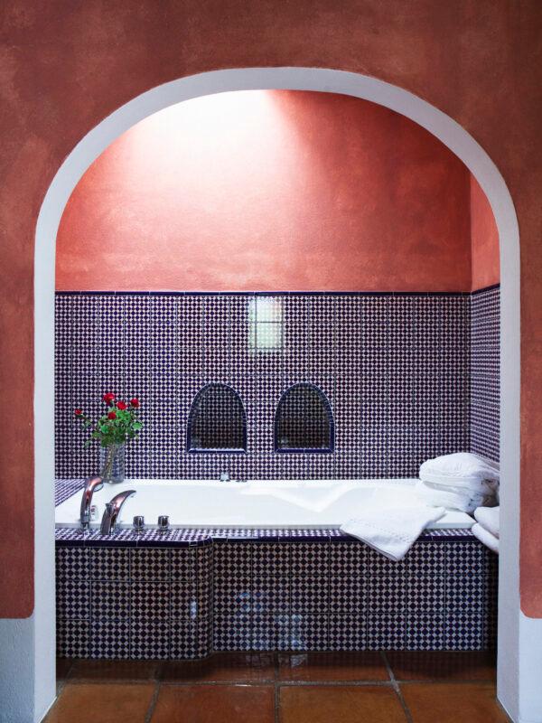 A suite bathroom with handpainted tiles. (Courtesy of Cas Gasi)