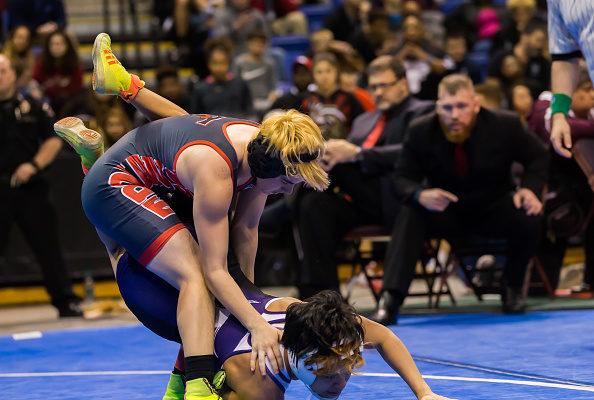 Trinity junior Mack Beggs, a transgender athlete, wrestles Katy Morton Ranch junior Chelsea Sanchez to the floor in the final round of the 6A Girls 110 Weight Class match during the Texas Wrestling State Tournament at Berry Center in Cypress, Texas, on Feb. 25, 2017. (Leslie Plaza Johnson/Icon Sportswire via Getty Images)