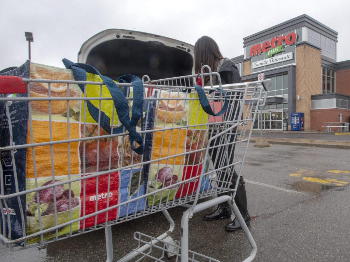A customer loads her groceries at a Metro store in Montreal, Canada, on April 15, 2019. (Ryan Remiorz/The Canadian Press)