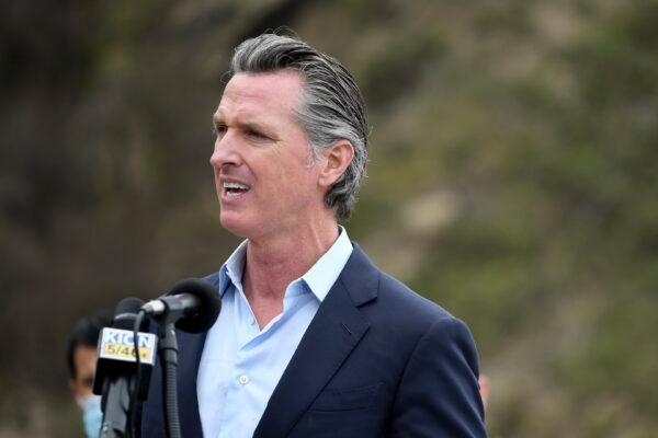 California Gov. Gavin Newsom speaks during a press conference about the newly reopened Highway 1 at Rat Creek near Big Sur, Calif., on April 23, 2021. (Nic Coury/AP Photo)