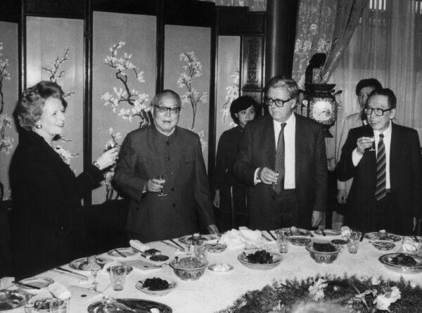 Then British Prime Minister Margaret Thatcher (L) drinking with Chinese President Li Xiannian (2dL), British Foreign Minister Goeffrey Howe (2dR) and Chinese Foreign Minister Wu Xueqian (R), in Beijing on Dec. 19, 1984. (Pierre-Antoine Donnet/AFP via Getty Images)