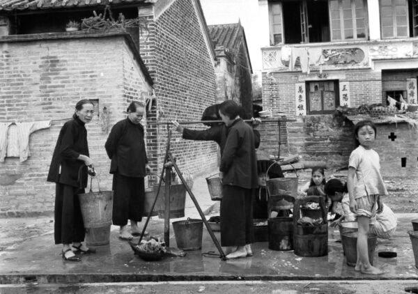 A view as Chinese refugees wait their turn for water in Hong Kong. Circa 1940. (Pictorial Parade/Getty Images)