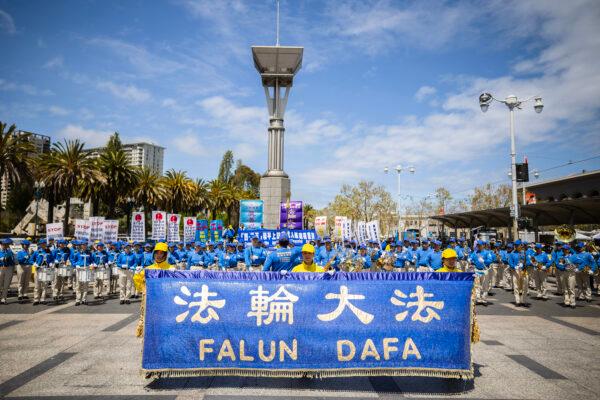 The Tian Guo Marching Band, consisting of Falun Dafa practitioners, plays at a rally in front of the Ferry Building in San Francisco on April 24, 2021, to raise awareness of the persecution occurring in China. (Christian Lambert/The Epoch Times)