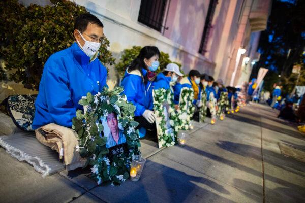 Falun Gong practitioners hold a candlelight vigil in front of the Chinese Consulate in San Francisco on April 23, 2021, to raise awareness of the persecution happening in China. (Christian Lambert/The Epoch Times)